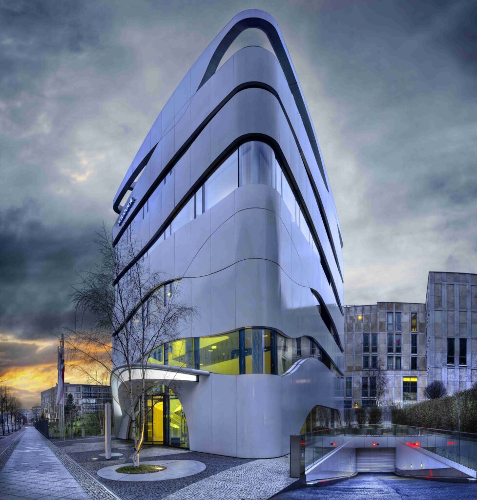 facade-modern-building-with-geometric-windows-curved-walls_11zon-977x1024 KDArchitecX.net: Your Guide to Innovative Architecture in 2025